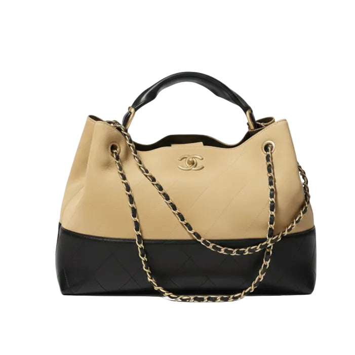 This New, Certified Authentic Chanel 25 Hobo Bag is a rare collector's piece, crafted in sumptuous tan quilted suede and finished with distinctive antique gold hardware.