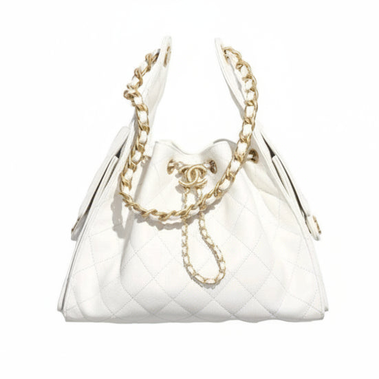White Chanel 25 small quilted handbag with gold chain and CC logo on a white background