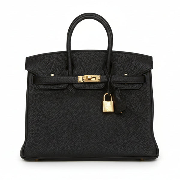 Black Hermes Birkin 25 togo handbag with gold hardware on a white background