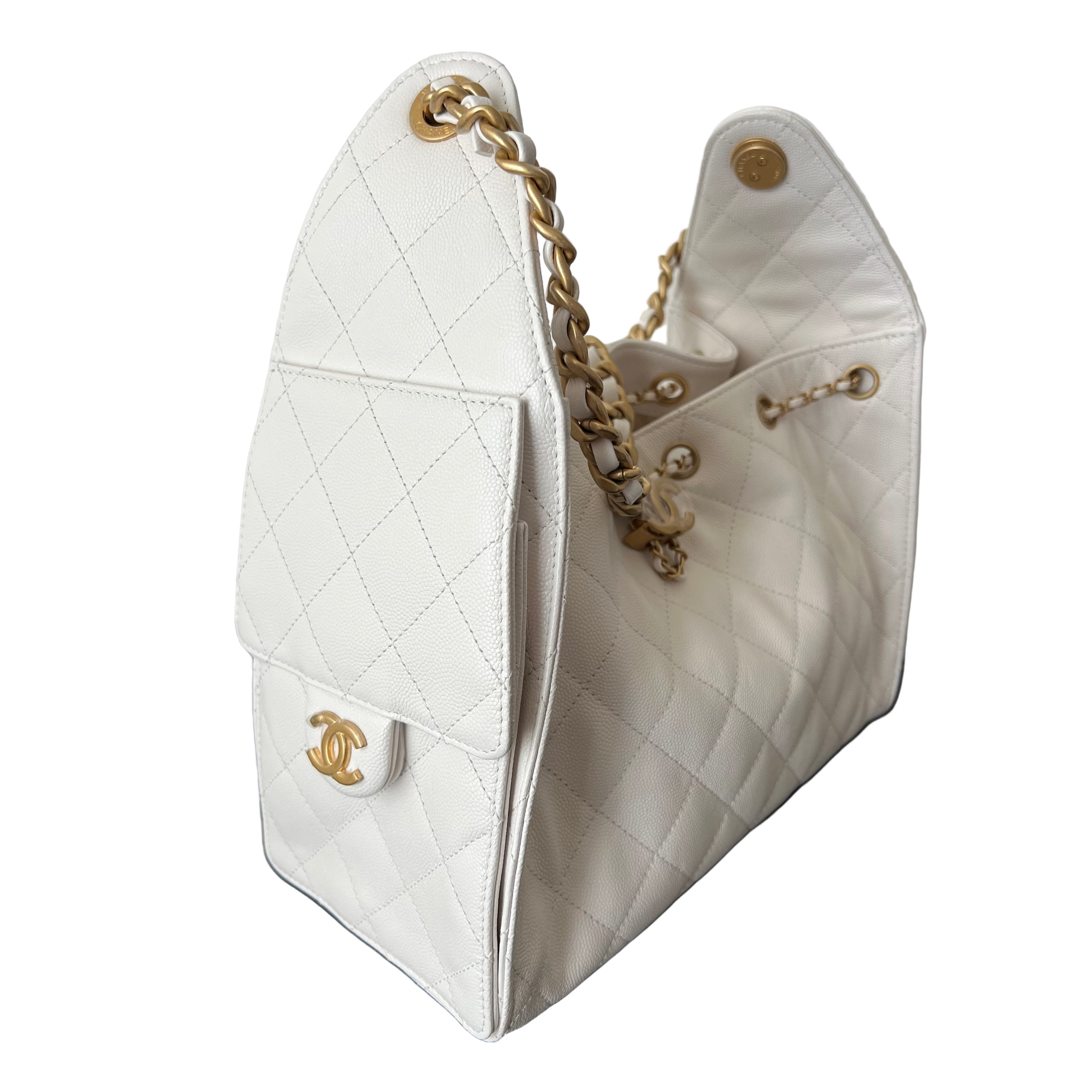 White Chanel 25 small quilted handbag with gold chain and CC logo on a white background
