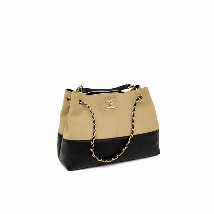 This New, Certified Authentic Chanel 25 Hobo Bag is a rare collector's piece, crafted in sumptuous tan quilted suede and finished with distinctive antique gold hardware.