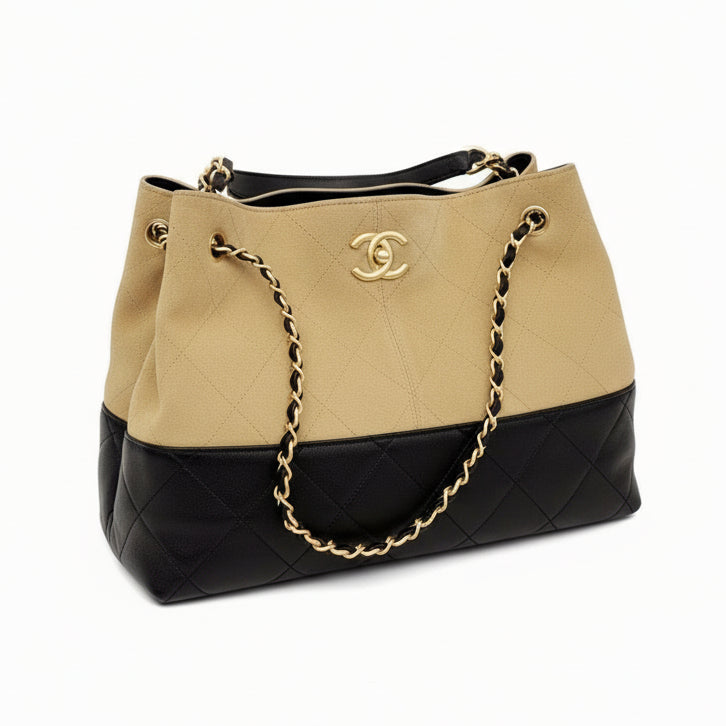 This New, Certified Authentic Chanel 25 Hobo Bag is a rare collector's piece, crafted in sumptuous tan quilted suede and finished with distinctive antique gold hardware.